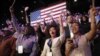 Supporters of President Barack Obama react to favorable media projections at the McCormick Place during an election night watch party in Chicago, Tuesday, Nov. 6, 2012.