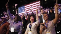 Supporters of President Barack Obama react to favorable media projections at the McCormick Place during an election night watch party in Chicago, Tuesday, Nov. 6, 2012.