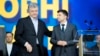 Ukrainian President Petro Poroshenko, left, and Ukrainian presidential candidate and popular comedian Volodymyr Zelenskiy attend debates at the Olympic stadium in Kyiv, Ukraine, April 19, 2019. 