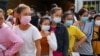 Garment factory workers and staff wait to receive China's Sinovac coronavirus disease (COVID-19) vaccine at an industrial park in Phnom Penh, Cambodia, April 7, 2021. REUTERS/Cindy Liu