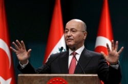 FILE - Iraq's President Barham Salih speaks to the media during a joint news conference with Turkey's President Recep Tayyip Erdogan, in Ankara, Turkey, Jan. 3, 2019.
