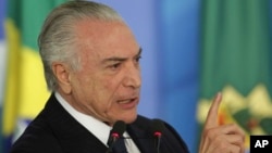 Brazil's President Michel Temer speaks during a ceremony at the Planalto Presidential Palace, in Brasilia, June 26, 2017. The country's attorney general has brought charges against the president.