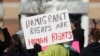 A supporter holds up a placard during a rally for Jeanette Vizguerra, a Mexican woman seeking to avoid deportation from the United States, outside the Immigration and Customs Enforcement office in Centennial, Colo., Feb. 15, 2017. U.S. immigration authorities have denied Vizguerra's request to remain in the country.