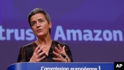 European Executive Vice-President Margrethe Vestager speaks during a press conference regarding an antitrust case with Amazon at EU headquarters in Brussels, Tuesday, Nov. 10, 2020. (Olivier Hoslet, Pool via AP)