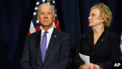 Vice President Joe Biden sits with Newtown, Connecticut's First Selectwoman Pat Llodra before speaking at a gun violence conference in Danbury, Conn., Feb. 21, 2013. 