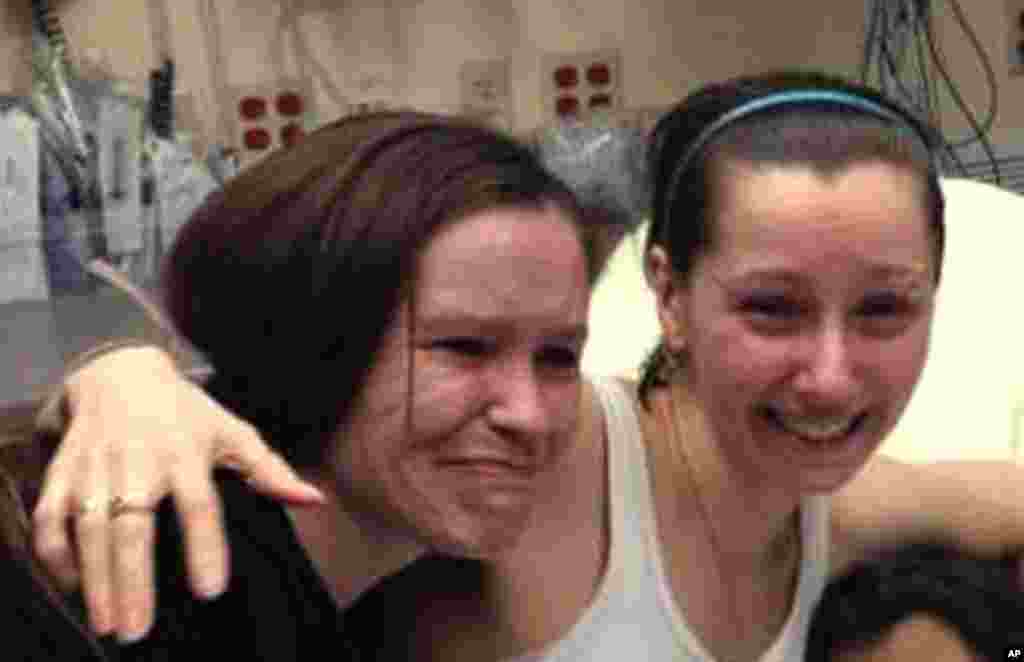 Amber Berry hugs her sister Beth Serrano after being reunited in a Cleveland hospital Monday May 6, 2013. (Family Handout courtesy WOIO-TV)