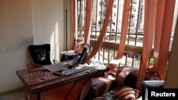 Damage and glass from broken windows is seen inside Hezbollah media center after an Israeli drone fell in the Hezbollah-dominated southern suburbs of Beirut, Lebanon, Aug. 25, 2019. 