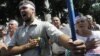Ukrainian opposition supporters sing national anthem during a protest, Kiev, July 30, 2012.