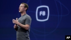 FILE - In this March 25, 2015, file photo, CEO Mark Zuckerberg gestures while delivering the keynote address at the Facebook F8 Developer Conference in San Francisco. On Sept. 15, Zuckerberg said Facebook may finally be getting a button that lets you quickly express something beyond a "like."