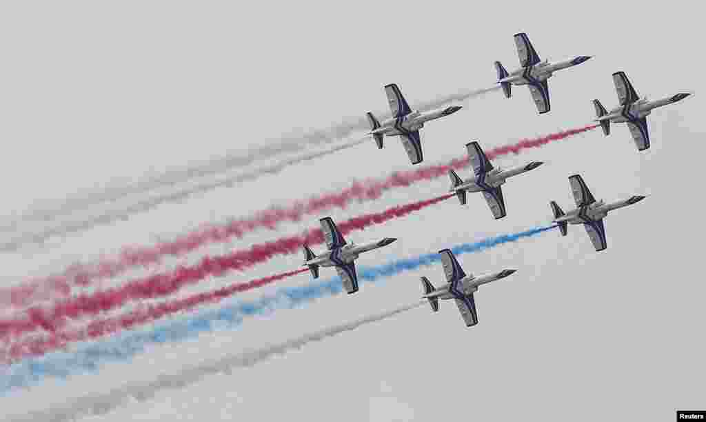 AT-3 jet trainer aircrafts perform during an Air Force drill at Chingchuankang Air Force Base in Taichung, central Taiwan.