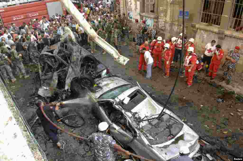 Lebanese Red Cross and civil defence personnel work at the site of an explosion in central Beirut, October 19, 2012.