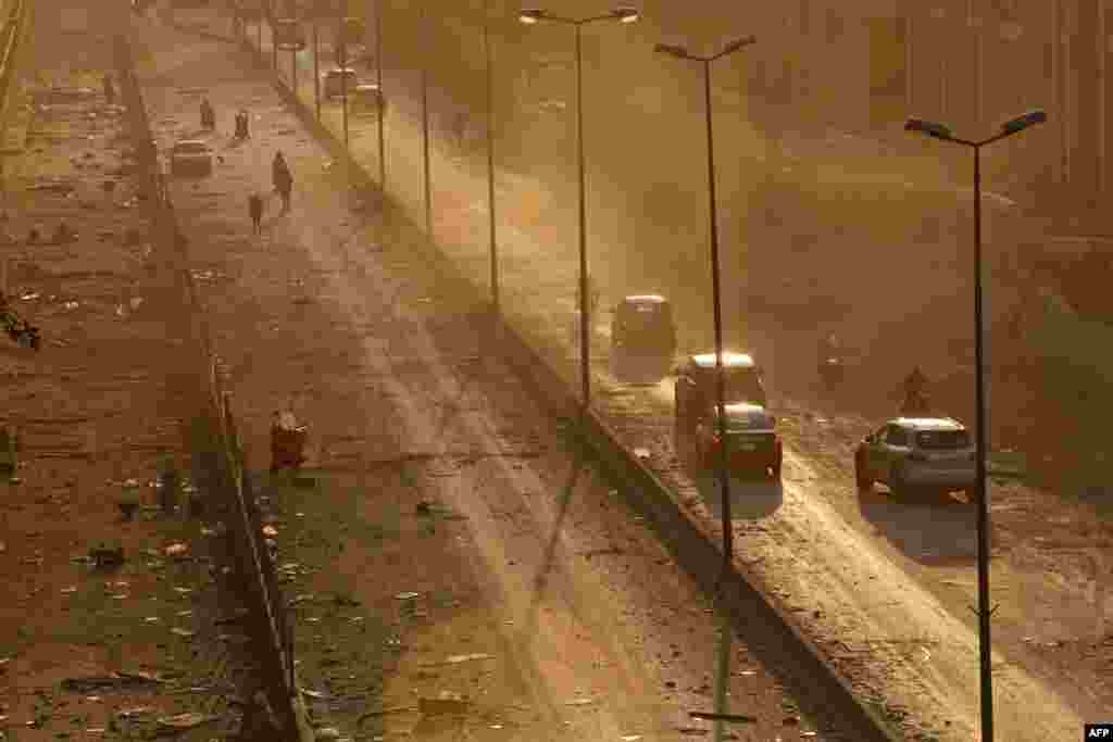 Debris is seen on a main road in Beirut at sunset following a twin explosion that shook the port of Lebanon's capital, Aug. 4, 2020.