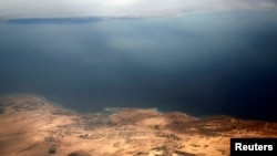 FILE - An aerial view of the coast of the Red Sea and the two islands of Tiran and Sanafir is pictured through the window of an airplane near Sharm el-Sheikh, Egypt Nov. 1, 2016. 