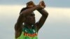 L'Ethiopien Feyisa Lilesa fait un signe pour protester contre le gouvernement éthiopien, lors des JO de Rio, le 21 août 2016.