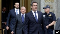 FILE - President Donald Trump's personal attorney Michael Cohen (R) and his attorney Stephen Ryan (2nd-L) leave Federal Court, in New York, May 30, 2018. 