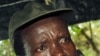 Joseph Kony, the Lord's Resistance Army (LRA) leader, left, and his deputy Vincent Otti, sit inside a tent at Ri-Kwamba in Southern Sudan. (Nov. 2006 file photo)