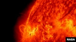 FILE - The sun is seen releasing a solar flare on May 14, 2013. (Credit: NASA/SDO)