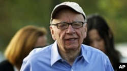 FILE - Rupert Murdoch, Australian-American media mogul and the chairman and chief executive of News Corporation, arrives at the Sun Valley Inn in Sun Valley, Idaho, July 7, 2011.
