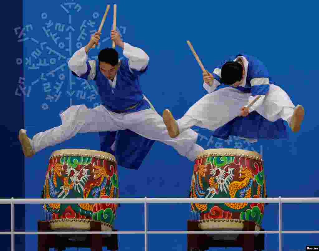 Drummers perform prior to the women's ice hockey match between Sweden and Switzerland at Kwandong Hockey Center in Gangneung, South Korea.