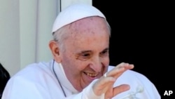 Pope Francis appears on a balcony of the Agostino Gemelli Polyclinic in Rome, July 11, 2021.