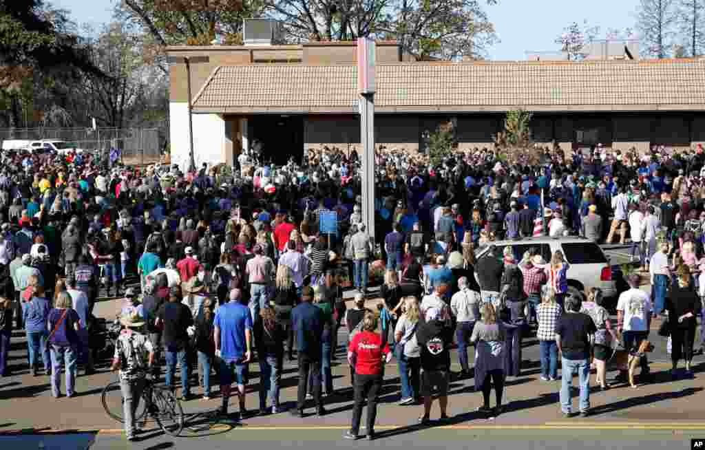 People gather for ceremonies for the one-year anniversary of the Camp Fire in Paradise, Calif., Nov. 8, 2019. There was 85 seconds of silence for the 85 people who died in last year's fire.