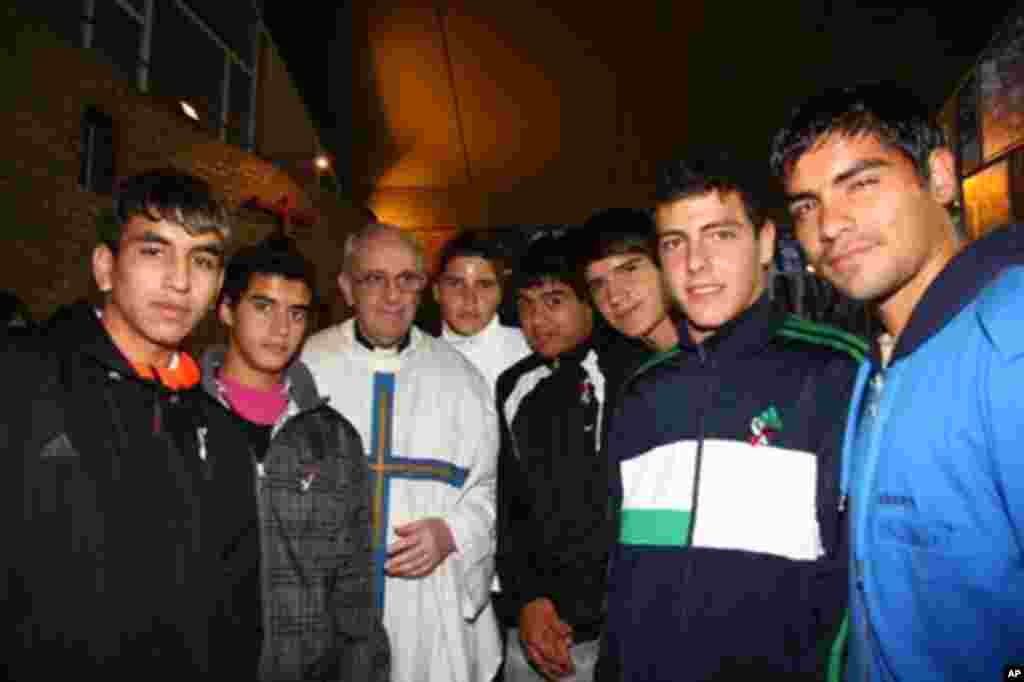 Argentina's Cardinal Jorge Bergoglio, third from left, poses with young players of the San Lorenzo soccer team inside the soccer club's chapel in Buenos Aires, March 24, 2011. Bergoglio was chosen as Pope on March 13, 2013, the first pope ever from the Americas and the first from outside Europe in more than a millenium. (AP Photo/Club Atletico San Lorenzo de Almagro)