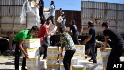 Pendistribusian Bantuan Program Pangan Dunia (WFP) di Al-Houla, utara Homs, Suriah Tengah, 25 Mei 2016. (Foto: dok). 