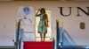 Michelle Obama waved hands upon her arrival at Siem Reap International Airport. (Photo: Neou Vannarin for VOA)