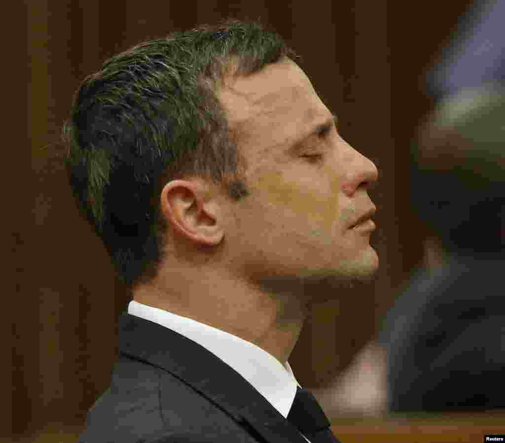 Olympic and Paralympic track star Oscar Pistorius reacts as he listens to Judge Thokozile Masipa's verdict at the North Gauteng High Court in Pretoria, Sept. 11, 2014. 