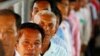 Cambodians line up at a court entrance before a hearing to prepare for the genocide trial of two surviving leaders Khieu Samphan and Noun Chea, at the U.N.-backed war crimes tribunal in Phnom Penh, file photo. 
