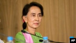 FILE - Myanmar's opposition leader Aung San Suu Kyi is seen in a Nov. 13, 2014, image in Naypyitaw, Myanmar.