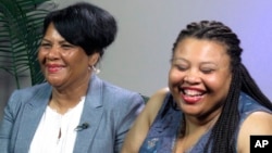 Alice Marie Johnson, left, and her daughter Katina Marie Scales wait to start a TV interview, June 7, 2018 in Memphis, Tennessee.