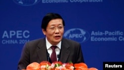 Chinese Finance Minister Lou Jiwei makes a speech at the APEC finance ministers meeting opening ceremony in Beijing, Oct. 22, 2014.