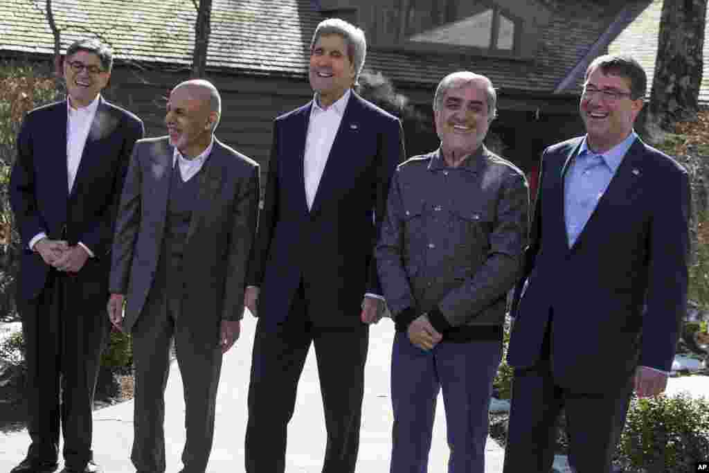 Secretary of State John Kerry, center, arrives at the Camp David Presidential retreat in Maryland with, from left, Treasury Secretary Jacob Lew, Afghanistan's President Ashraf Ghani, Kerry, Afghanistan's Chief Executive Abdullah Abdullah, and Defense Secretary Ashton Carter.