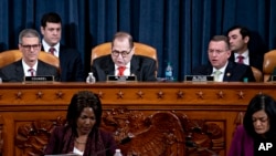 House Judiciary Committee Chairman Rep. Jerrold Nadler, D-N.Y., center, announces the adjournment, as ranking member Doug Collins, R-Ga., right, looks on following a marathon debate during a markup of the articles of impeachment against President Trump