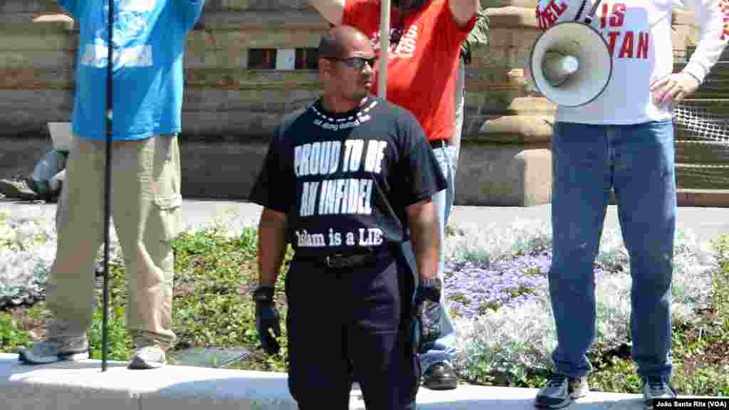 A protester showing a t-shirt saying: "Proud to be an Infidel Islam is a lie" outside the Republican Convention arena in Cleveland