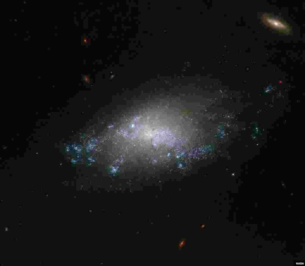This image of the spiral galaxy NGC 3274 comes courtesy of the NASA/ESA Hubble Space Telescope’s Wide Field Camera 3 (WFC3). Hubble’s WFC3 vision spreads from the ultraviolet light through to the near infrared, allowing astronomers to study a wide range of targets, from nearby star formation through to galaxies in the most remote regions of the cosmos.
