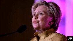 Former Secretary of State Hillary Clinton speaks during a fundraising event for Big Sister Association of Greater Boston, Dec. 5, 2017, in Boston. Clinton was presented with the organization's Believe in Girls award during the event.