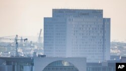 The central building of Charite hospital where Russian dissident Alexei Navalny is treating, seen behind the Chancellery in Berlin, Tuesday, Aug. 25, 2020. German Chancellor Angela Merkel is calling on Russian authorities to conduct a full…