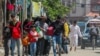 People flee the eastern parts of Rafah after the Israeli military began evacuating Palestinian civilians ahead of a threatened assault on the southern Gazan city