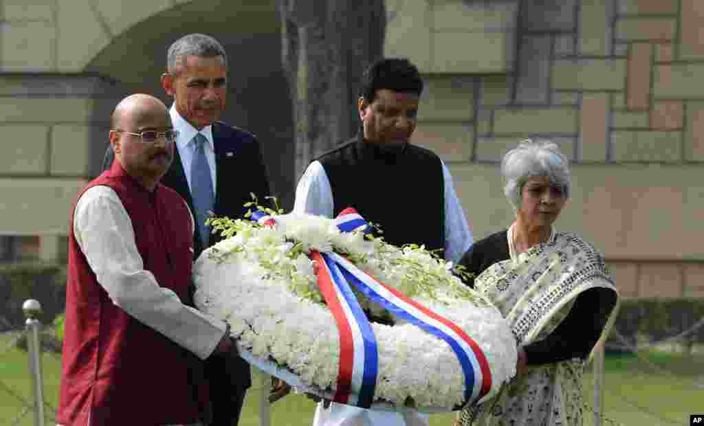 U.S. President Barack Obama arrives to offer floral tributes at the site where Indian independence icon Mahatma Gandhi was cremated in New Delhi, Jan. 25, 2015.