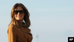 First lady Melania Trump boards a plane, Monday, Oct. 1, 2018, in Andrews Air Force Base, Maryland, en route to Africa. 