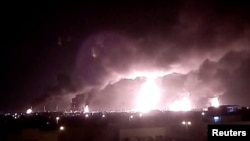 Fires burn in the distance after a drone strike by Yemen's Iran-aligned Houthi group on Saudi company Aramco's oil processing facilities, in Buqayq, Saudi Arabia September 14, 2019 in this still image taken from a social media video obtained by Reuters.