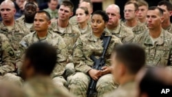 FILE - Soldiers listen to U.S. Defense Secretary Ash Carter at Kandahar Airfield in Afghanistan, Feb. 22, 2015.