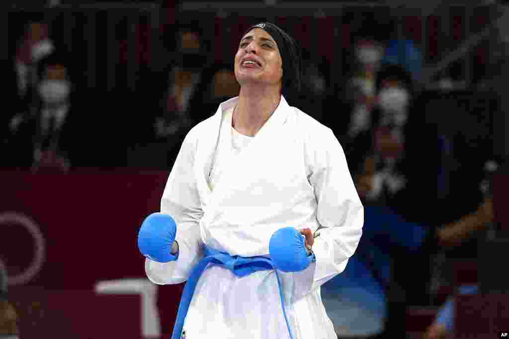 Feryal Abdelaziz of Egypt reacts after winning her women's kumite +61kg gold medal bout for karate at the 2020 Summer Olympics, Saturday, Aug. 7, 2021, in Tokyo, Japan. (AP Photo/Vincent Thian)