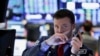 Dow Jones cierra al alza en turbulento día