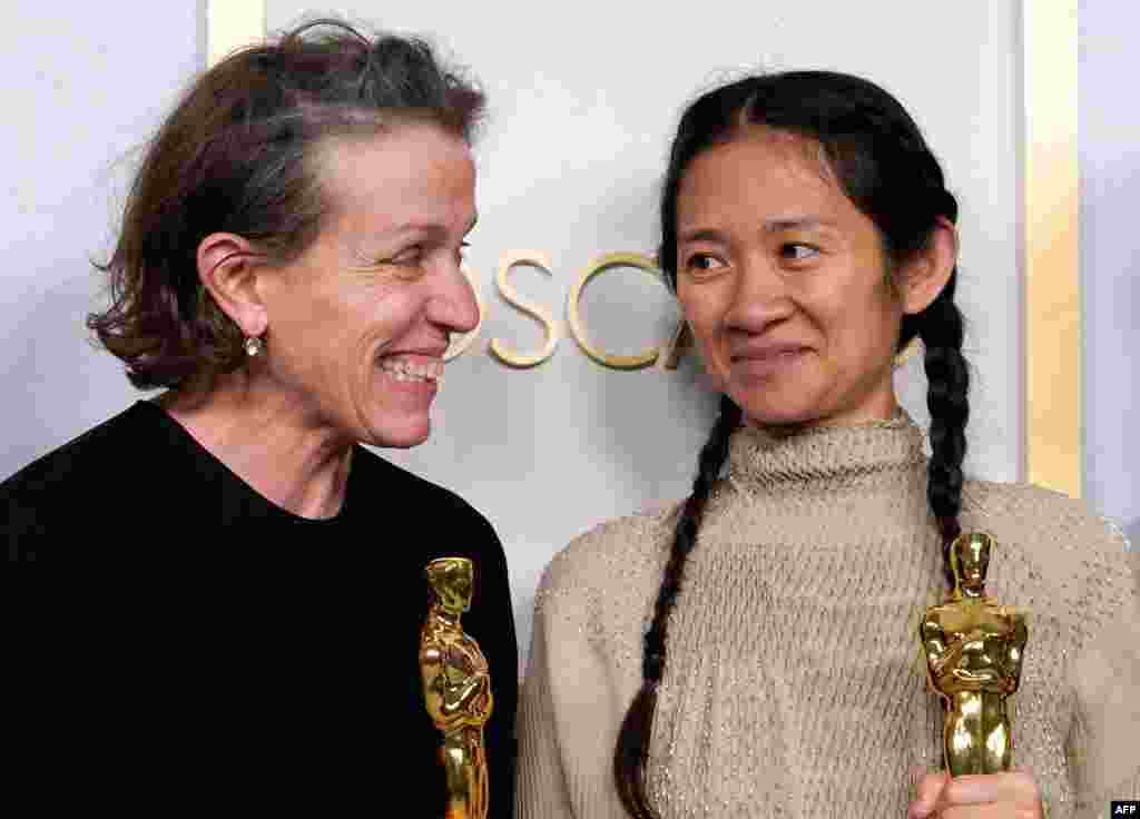 Producers Frances McDormand and Chloe Zhao, hold the Oscar for Best Picture for "Nomadland" as they pose in the press room at the Oscars on April 25, 2021, at Union Station in Los Angeles. - McDormand also won for Actress in a Leading Role for …