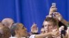 President Barack Obama reaches out to students and parents at Washington-Lee High School in Arlington, Virginia, May 4, 2012. 