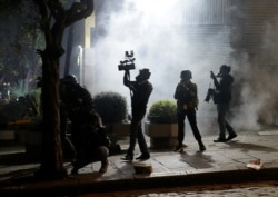 FILE - Journalists are seen during a protest in La Paz, Bolivia, Oct. 24, 2019.