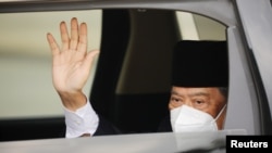 Malaysian Prime Minister Muhyiddin Yassin arrives at the National Palace for a meeting with the king, in Kuala Lumpur, Malaysia, Aug. 16, 2021.